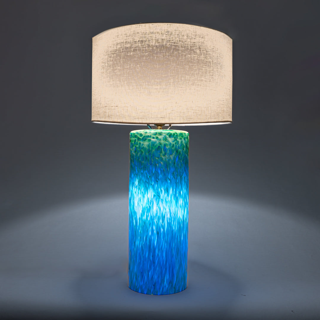 Wimberley Glassworks 3-way Lighted Glass Base Cylinder Table Lamp with Fabric Shade and Monet green on sapphire blue glass pattern