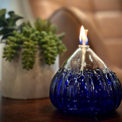 These Wimberley Glassworks signature hand blown liquid candles illuminate variations of hues to enhance the ambiance of a space.