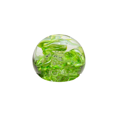 Green and clear glass sphere on a light gray background