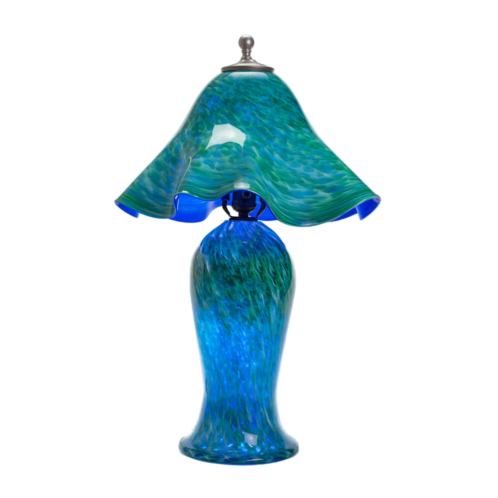Wimberley Glassworks All Glass table lamp with lighted base and blue and green swirl design